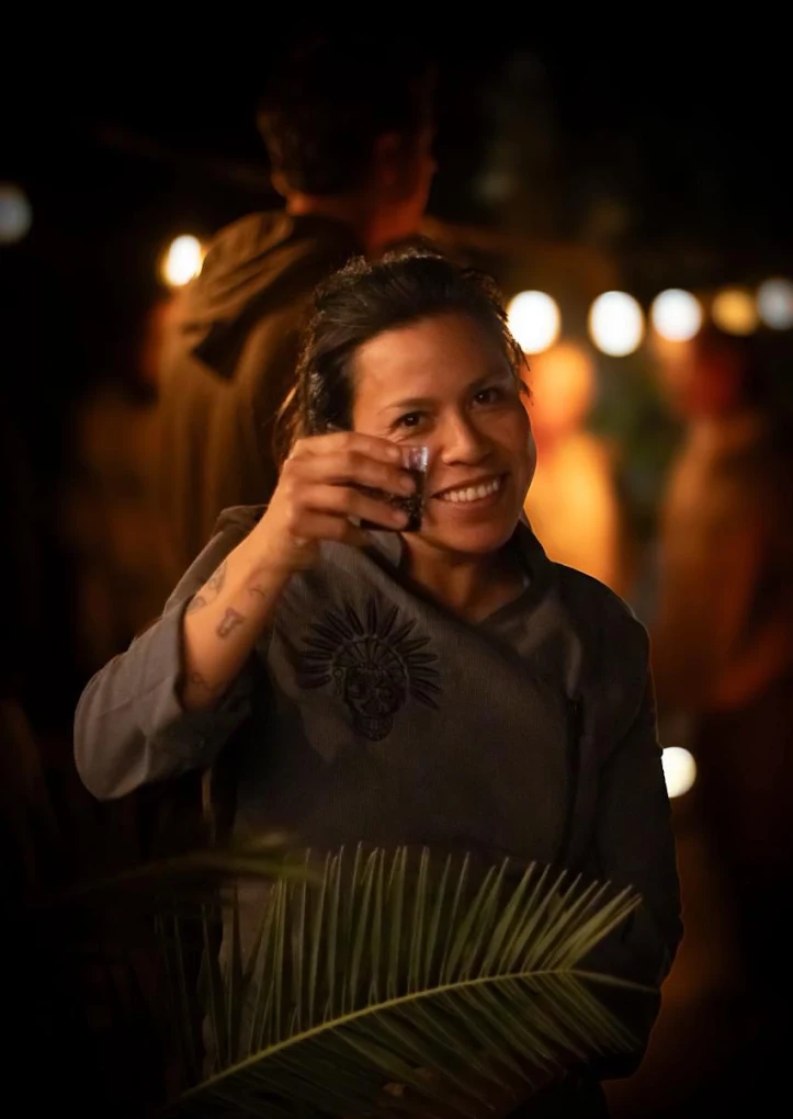 Host raising a glass during an evening at Casa Xolo